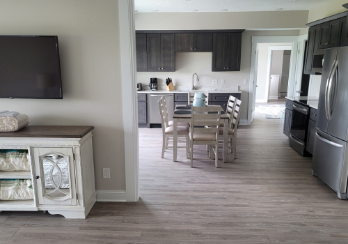 2 Bedroom Corner Suite Kitchen and Dining Area Looking into Master Bedroom Entry